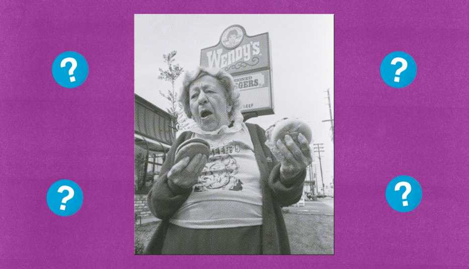 lady holding two hamburgers