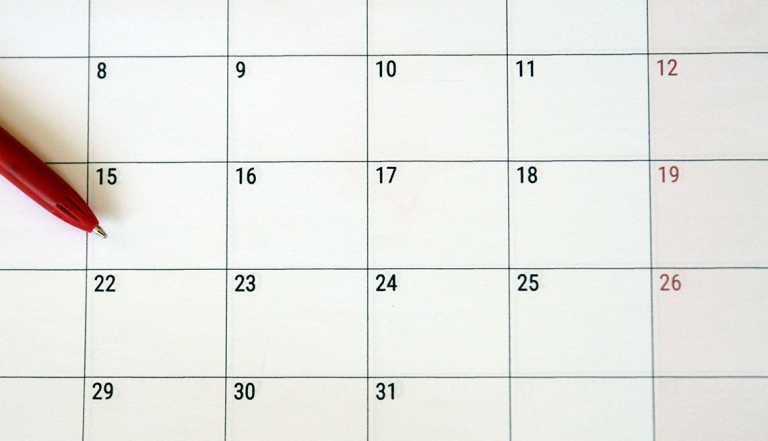 A pen lying on a calendar