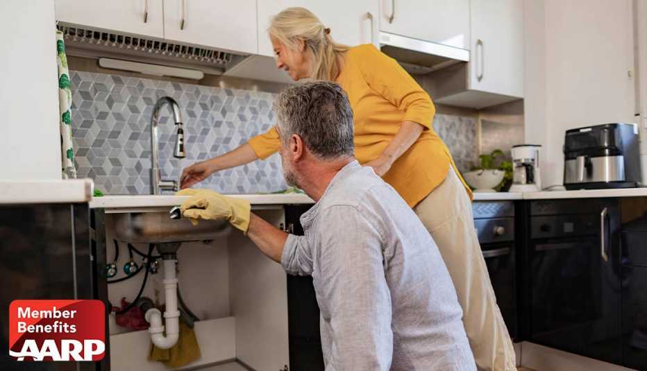 An older couple works together in a kitchen