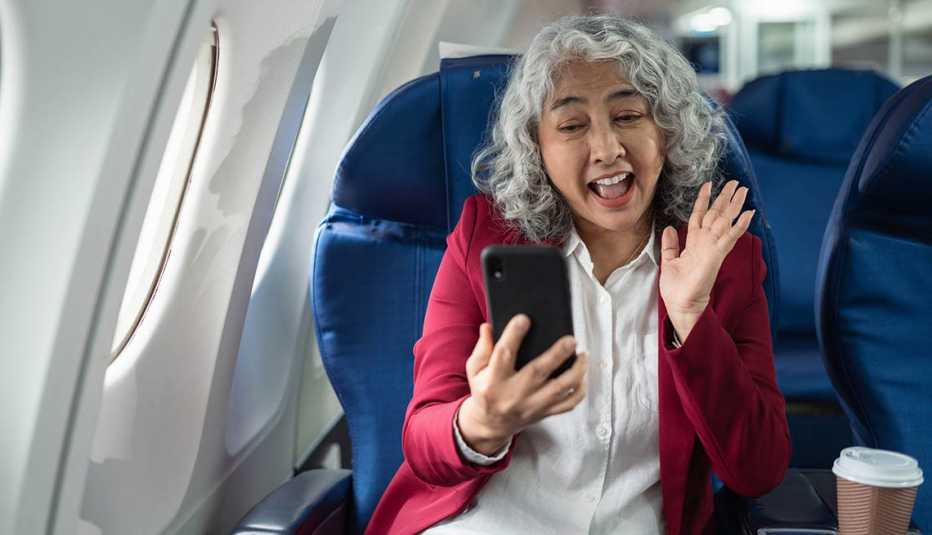 Happy traveler sharing trip updates mid air