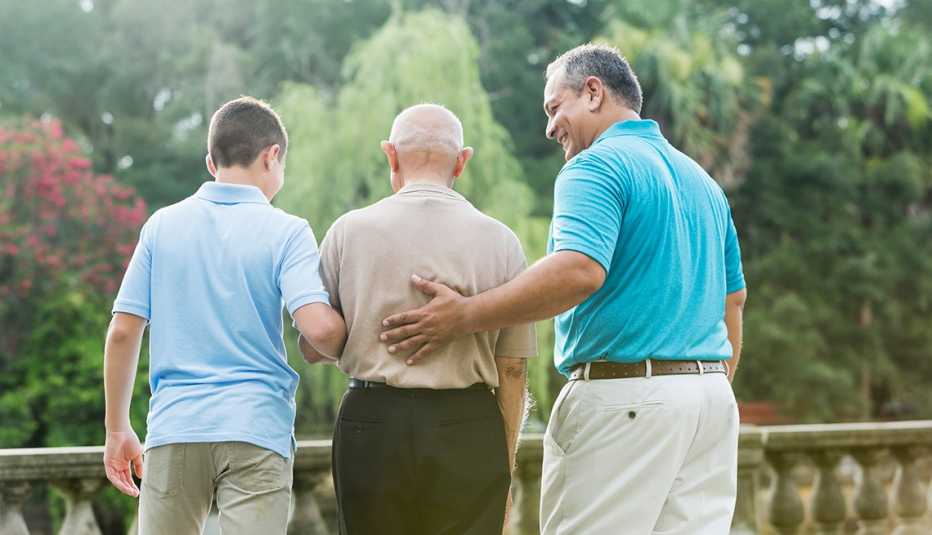 Rear view of a man with his teenage son and father