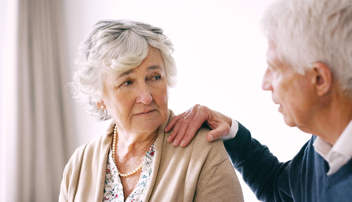 man comforting a woman