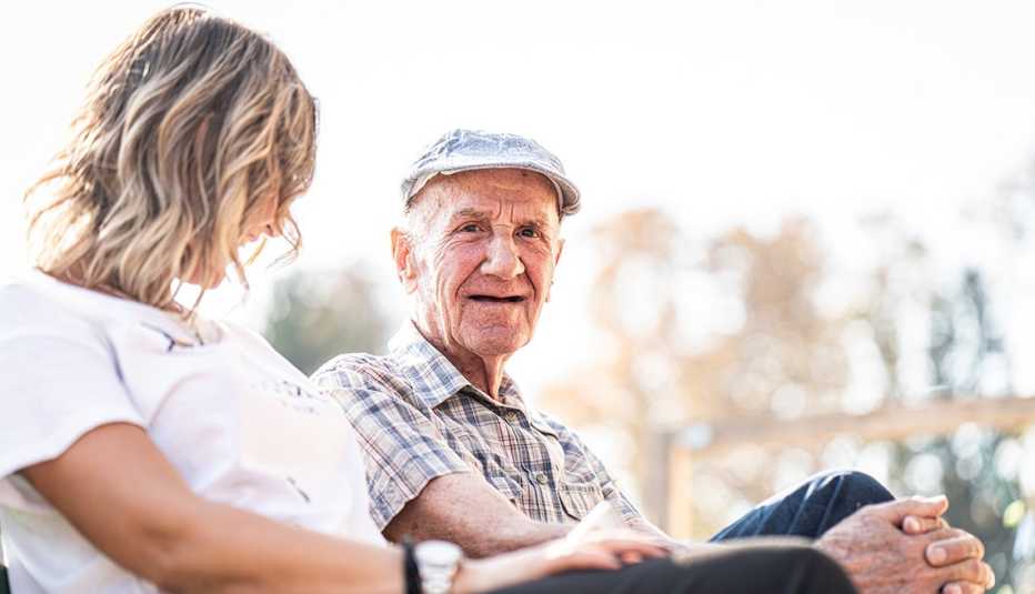 woman and man sitting and talking