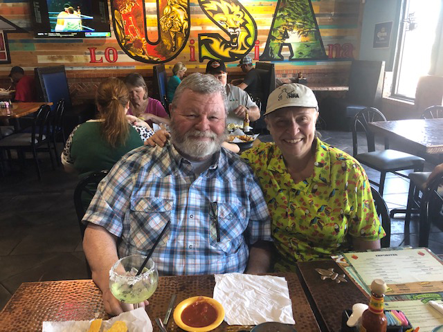 marty and ed douglass sitting together in a restaurant