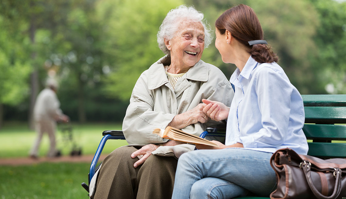 woman with caregiver in the park