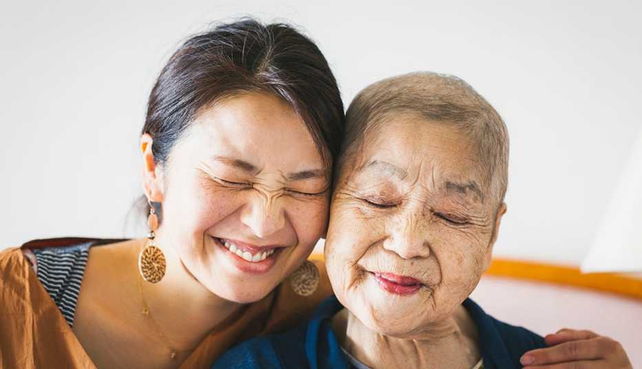 portrait of woman hugging her mother