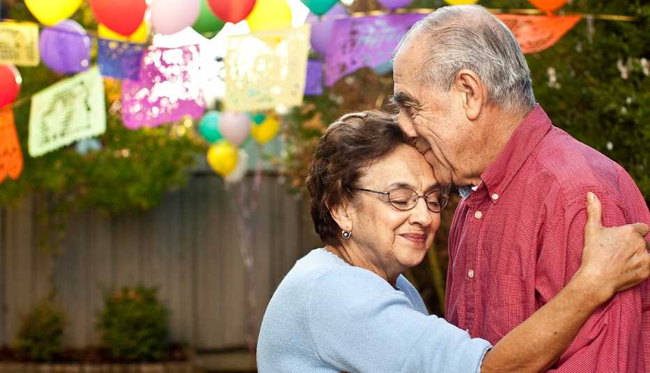 Mature Hispanic Couple Embrace, Outdoor Party Balloons, Creating a Living Will, Health Care Power of Attorney