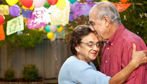 Mature Hispanic Couple Embrace, Outdoor Party Balloons, Creating a Living Will, Health Care Power of Attorney