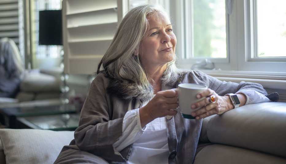 woman looking out a window