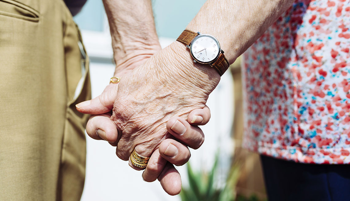 rear view of a couple holding hands