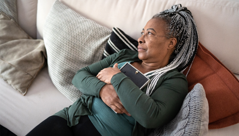 a grieving woman holding a photograph a grieving woman holding a photograph