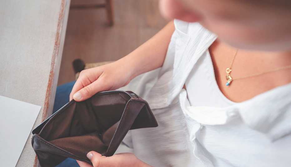 woman opening an empty wallet