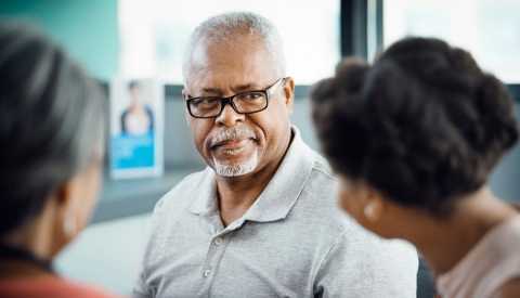 Man looking at people: Common Caregiving Conflicts Man looking at people: Common Caregiving Conflicts