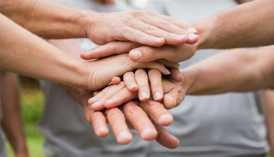 close up of hands on top of each other