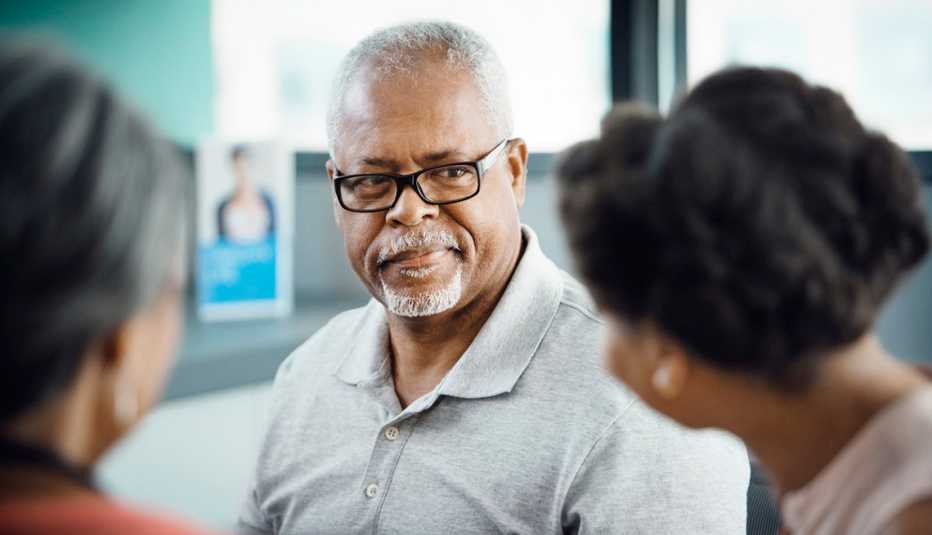 Man looking at people: Common Caregiving Conflicts Man looking at people: Common Caregiving Conflicts