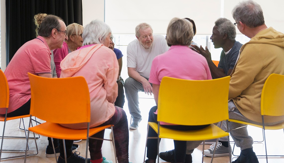 Group of older people sitting in chars in a support grop Group of older people sitting in chars in a support grop