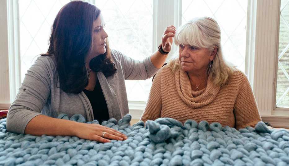 Stephanie Hanamaikai brushes hair from her mother&rsquo;s face