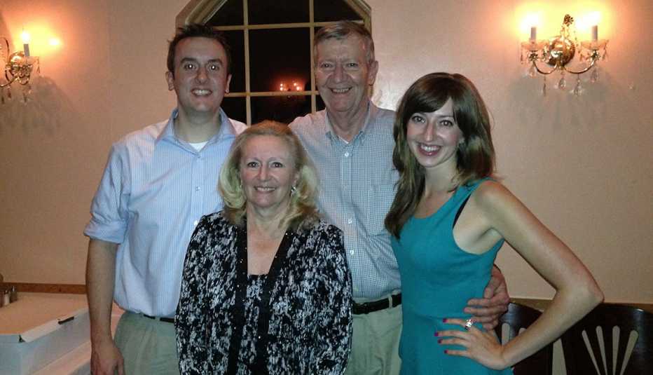 Caregiver Kristin Davie poses with her brother and parents