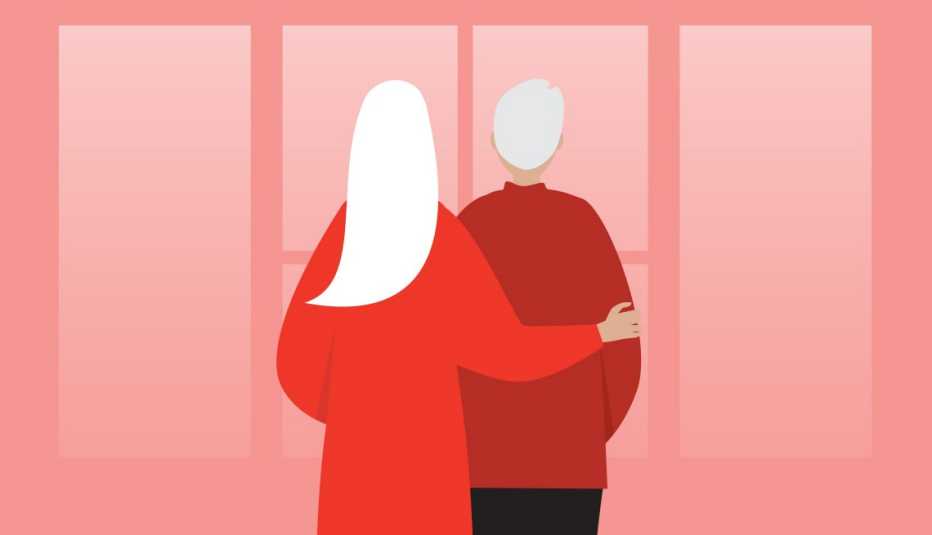 Two older adults embrace