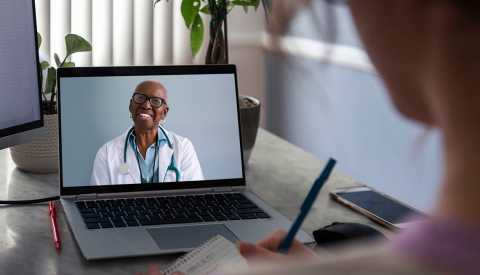 telehealth appointment with doctor's image on computer telehealth appointment with doctor's image on computer