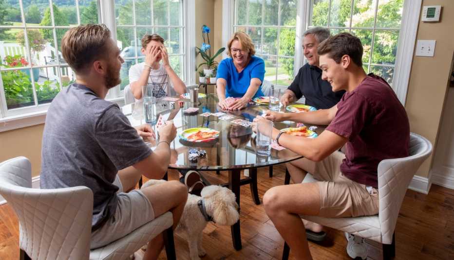 the ritter family playing cards and eating pizza