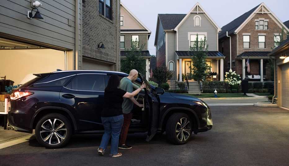 ethan and joy frank collins getting into the car at their home to drive to a medical appointment