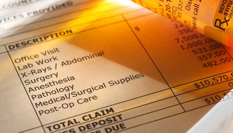 Pill bottle and bills 