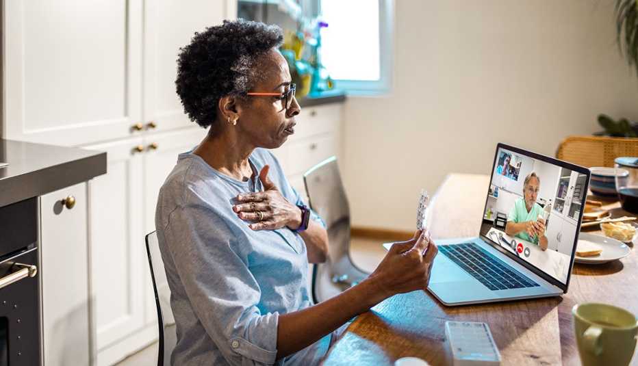 Close up of a woman on a video call with her doctor