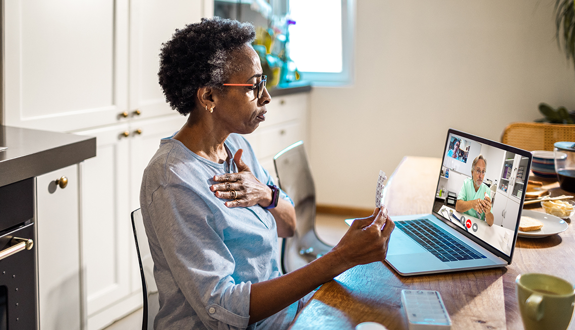 Close up of a woman on a video call with her doctor