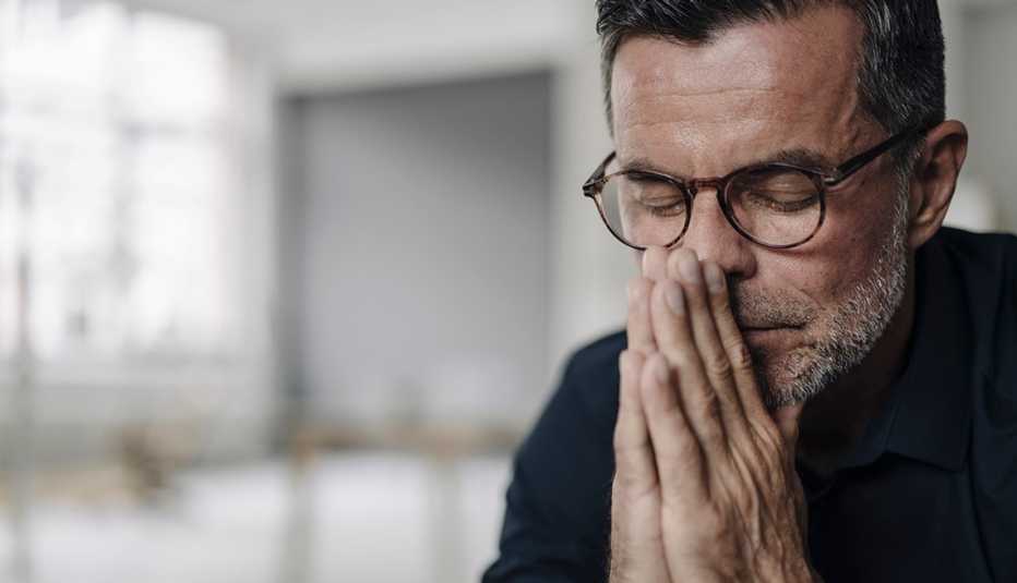 a stressed looking male family caregiver