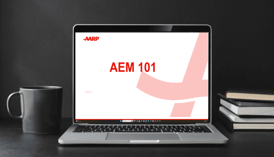 Laptop sitting on a desk with AEM 101 on the screen