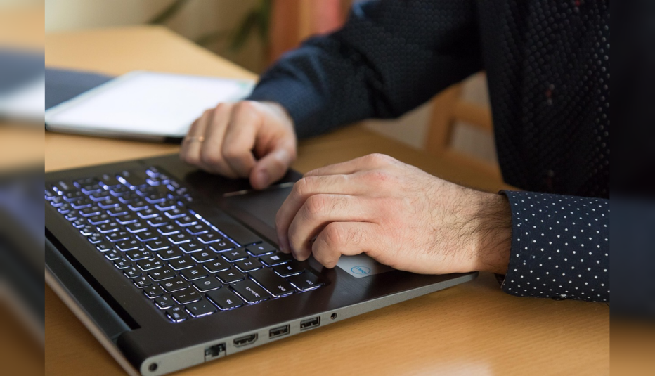 Man typing on a laptop