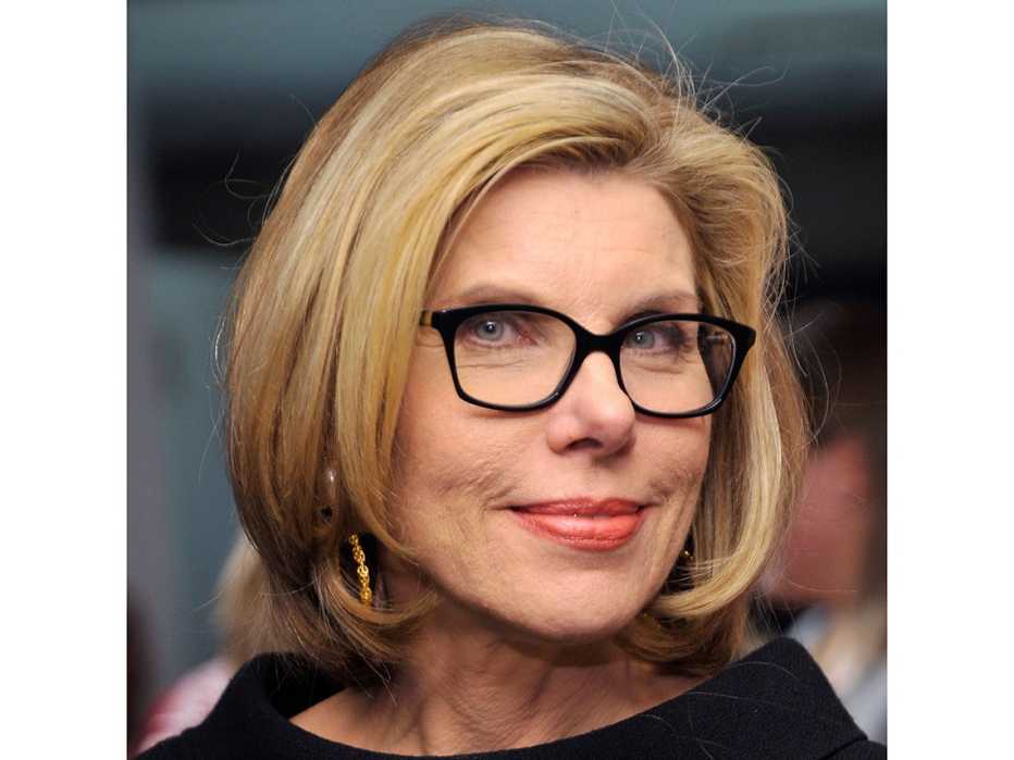 Christine Baranski wearing black rim glasses.