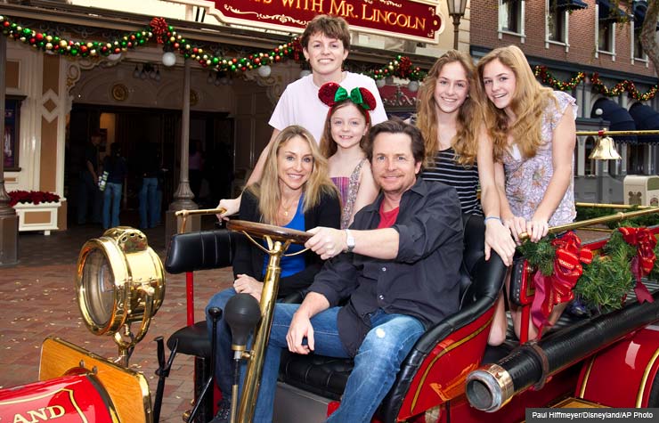 Michael J. Fox, his wife Tracy Pollan, and their kids pose at Disneyland Michael J. Fox, his wife Tracy Pollan, and their kids pose at Disneyland