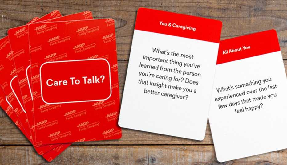 product photo of the red-backed care to talk cards showing the backs of four cards fanned out and the fronts of two cards with questions on them