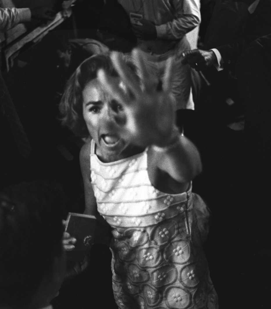 Ethel Kennedy holding her hand up to camera