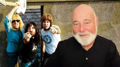 director rob reiner in front of an image from the move 'this is spinal tap'