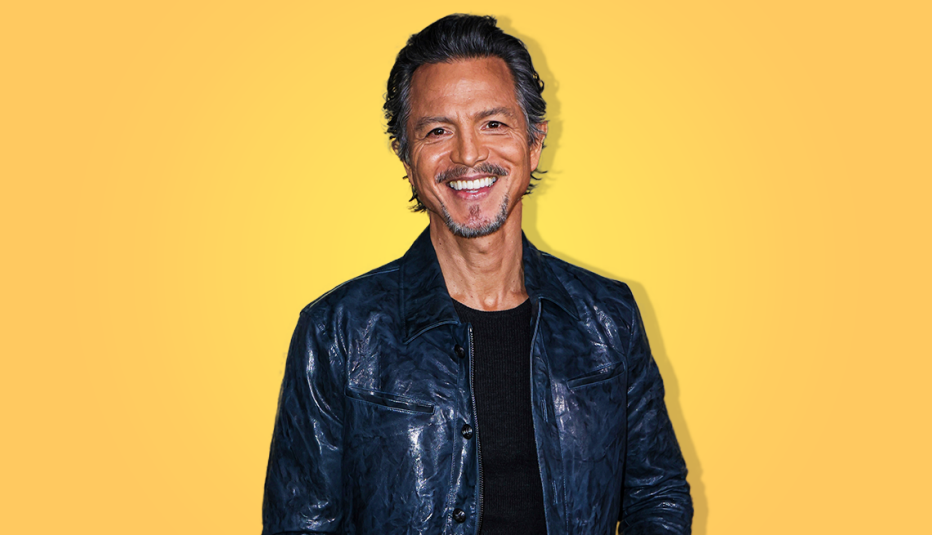 benjamin bratt smiling against yellow background