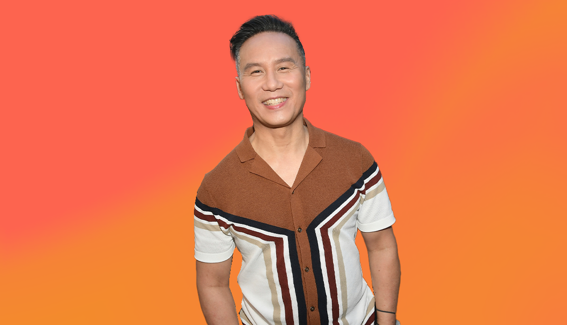 b d wong against orange ombre background