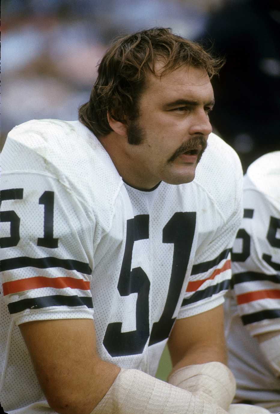 Chicago Bears linebacker Dick Butkus watching the game against the Atlanta Falcons while sitting on the bench. chicago bears linebacker dick butkus watching the game against the atlanta falcons while sitting on the bench