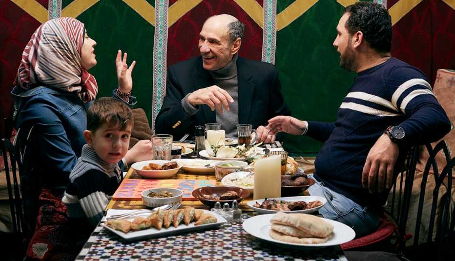 F. Murray Abraham with a family at a New York cafe.