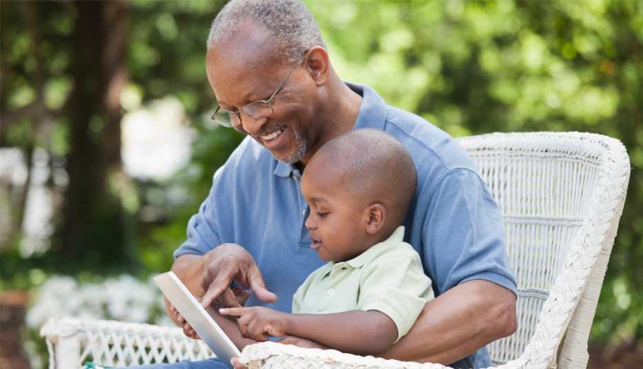 a grandfather reading to his grandchild