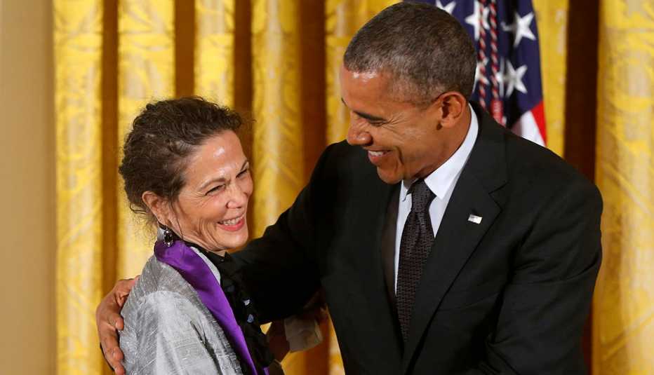President Obama with an arm around Julia Alvarez. President Obama with an arm around Julia Alvarez.