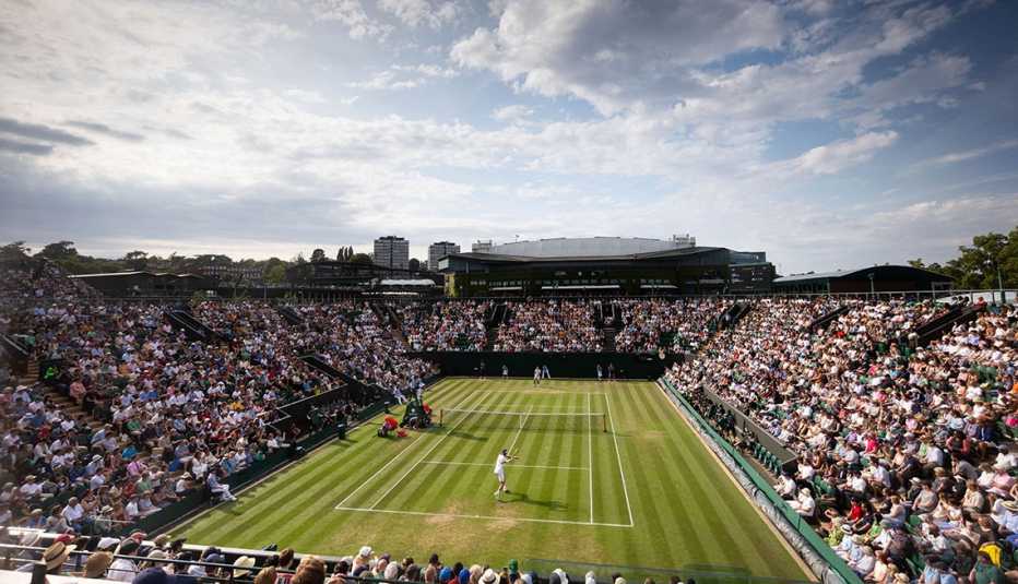 stefanos tsitsipas and laszlo djere at the wimbledon mens singles match in london england twenty twenty three
