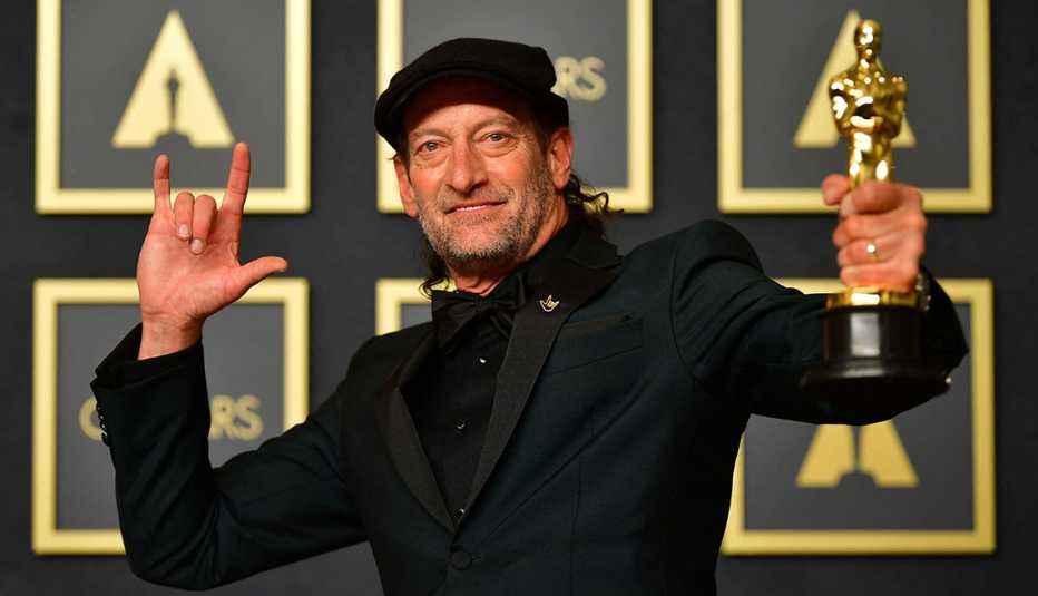 Actor Troy Kotsur holding his Oscar at the Academy Awards Actor Troy Kotsur holding his Oscar at the Academy Awards