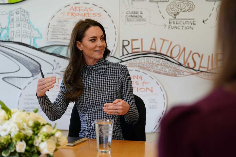 Catherine, Princess of Wales, sitting at a table during her visit at The Center on the Developing Child at Harvard University