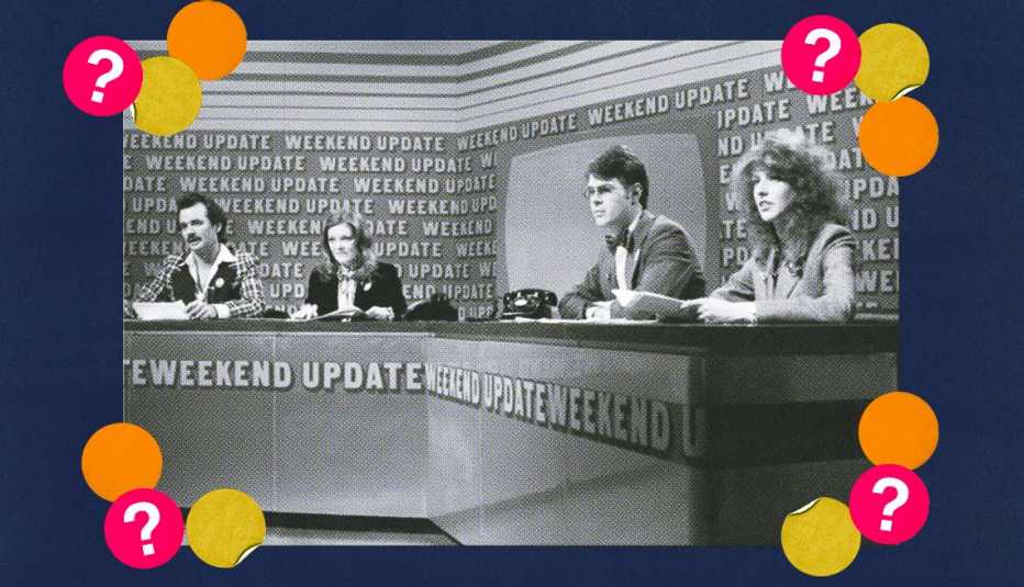 Bill Murray, Jane Curtin, Dan Aykroyd and Laraine Newman sitting at desk that says Weekend Update on the front; surrounded by yellow, orange and red circles with question marks in them