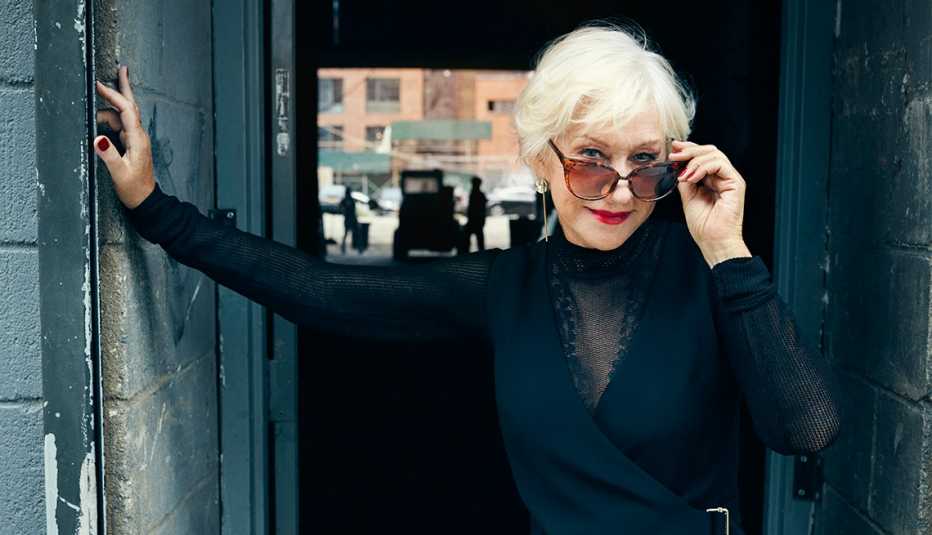 Helen Mirren looking over her sunglasses at camera