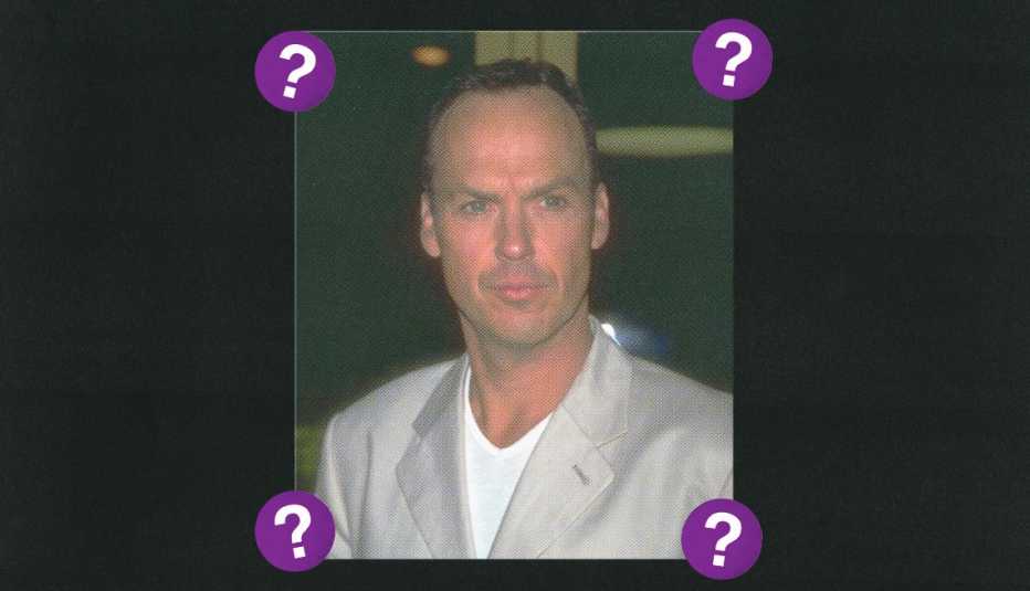 Michael Keaton; surrounded by purple circles with question marks in them