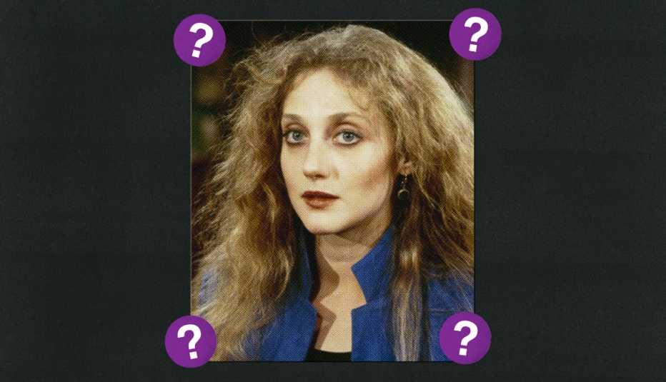 Carol Kane; surrounded by purple circles with question marks in them